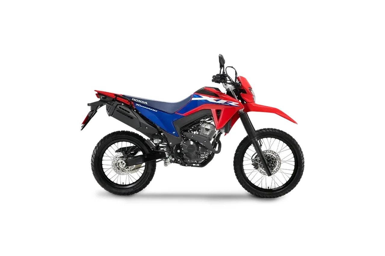 Honda XR 300L Tornado vermelha e azul, trail vista de lado